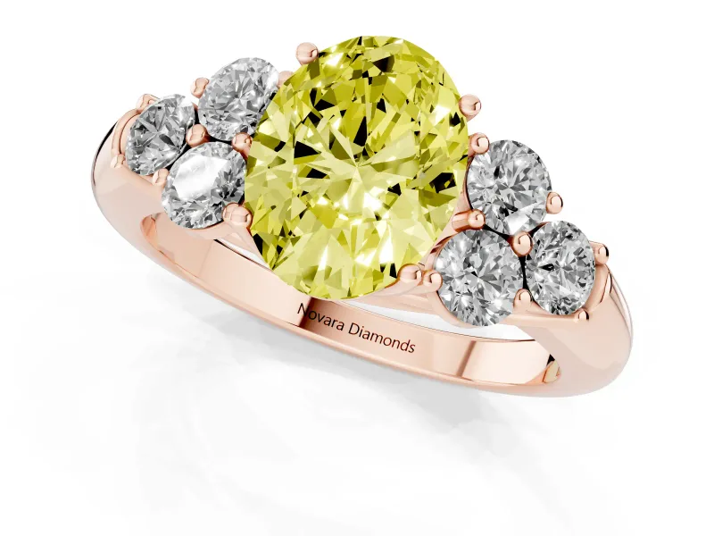 Fancy Yellow Oval Cut Diamond Cluster Ring Set in Rose gold with Round Accent Stones and Prong Setting on a Plain Band