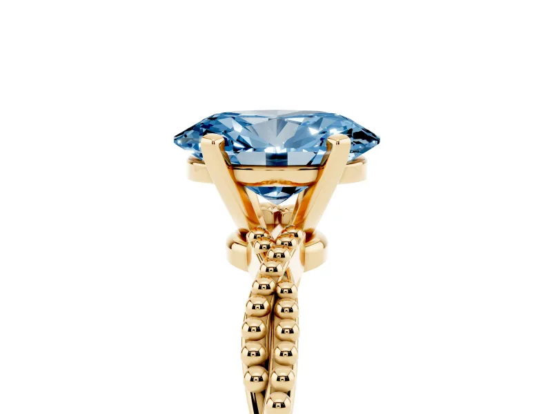 Fancy Blue Oval Cut Diamond Solitaire Ring Set in Yellow gold with Twisted Band and Bead Prong Setting