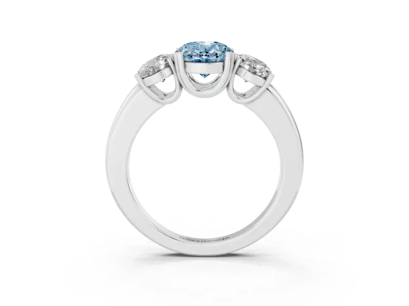 Fancy Blue Oval Cut Diamond Three-Stone Ring Set in Platinum with Polished Band and Prong Setting