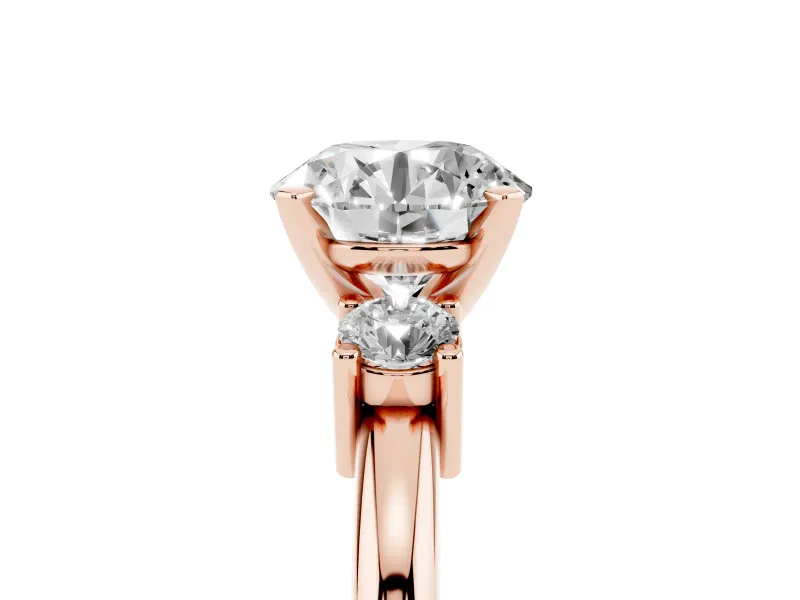 Three-Stone Round Cut Diamond Ring Set in Rose gold with Prong Setting and Plain Band