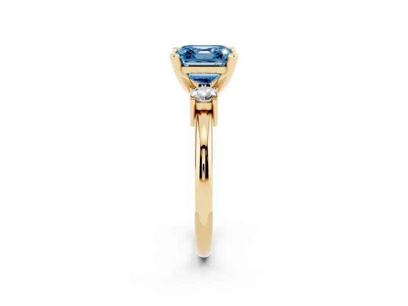 Fancy Blue Three-Stone Asscher Cut Diamond Ring Set in Yellow gold with Prong Setting and Plain Band