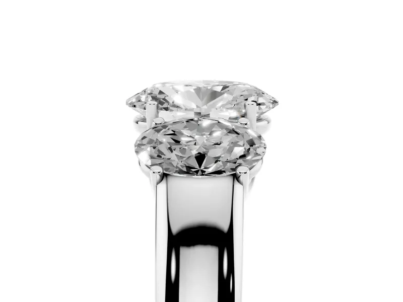 Three-Stone Oval Cut Diamond Ring Set in Platinum with Matching Prong Settings and Plain Band