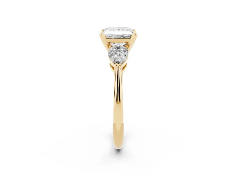 Three-Stone Princess Cut Diamond Ring Set in Yellow gold with Pear Side Stones and Prong Setting