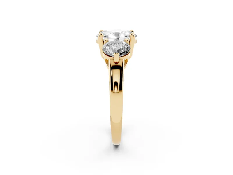 Oval Cut Diamond Three-Stone Ring Set in Yellow gold with Prong Setting and Classic Band