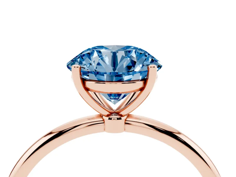 Fancy Blue Round Cut Diamond Solitaire Engagement Ring Set in Rose gold with Thin Band and Prong Setting