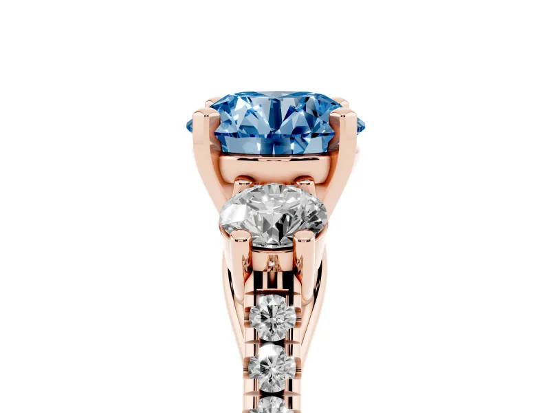 Fancy Blue Three-Stone Round Cut Diamond Pavé Band Ring Set in Rose gold with Prong-Set Trio