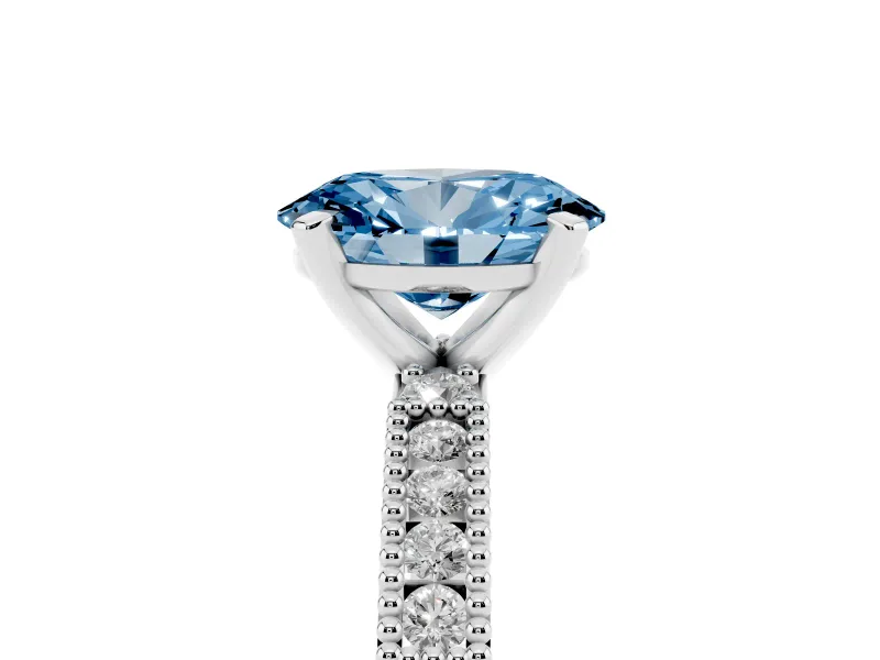 Fancy Blue Oval Cut Diamond Solitaire Ring Set in Silver with Slim Pavé Band and Prong Setting