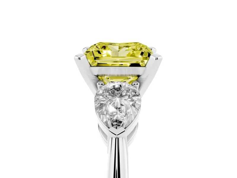 Fancy Yellow Three-Stone Princess Cut Diamond Ring Set in Platinum with Pear Side Stones and Prong Setting