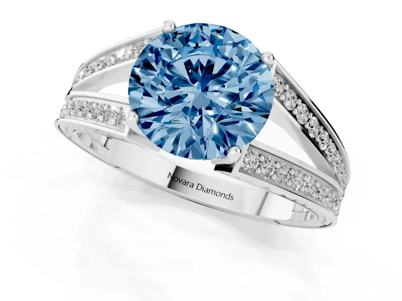 Fancy Blue Round Cut Diamond Split Shank Ring Set in White gold with Pavé Band and Prong Setting