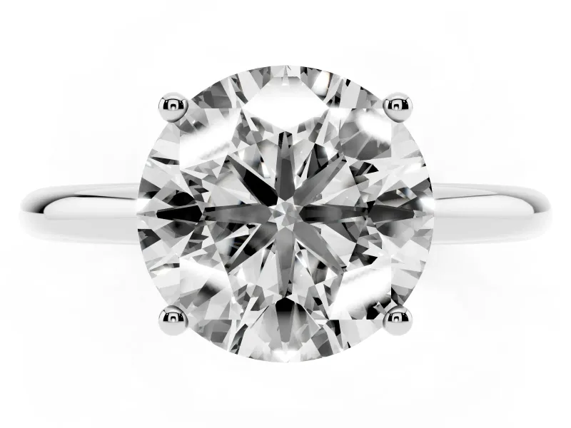Round Cut Diamond Solitaire Engagement Ring Set in Silver with Prong Setting and Polished Band