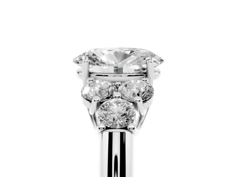Oval Cut Diamond Cluster Ring Set in Platinum with Round Accent Stones and Prong Setting on a Plain Band
