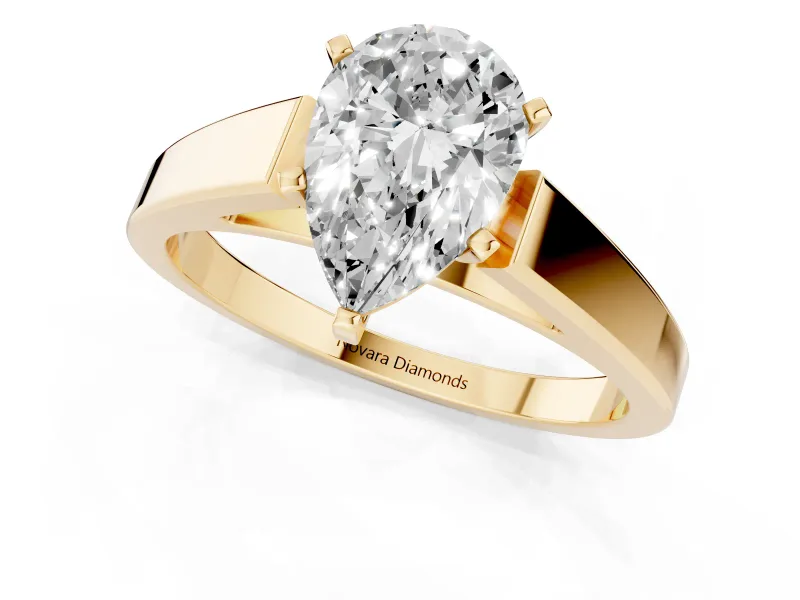 Pear Cut Diamond Solitaire Engagement Ring Set in Yellow gold with Prong Setting and Tapered Band