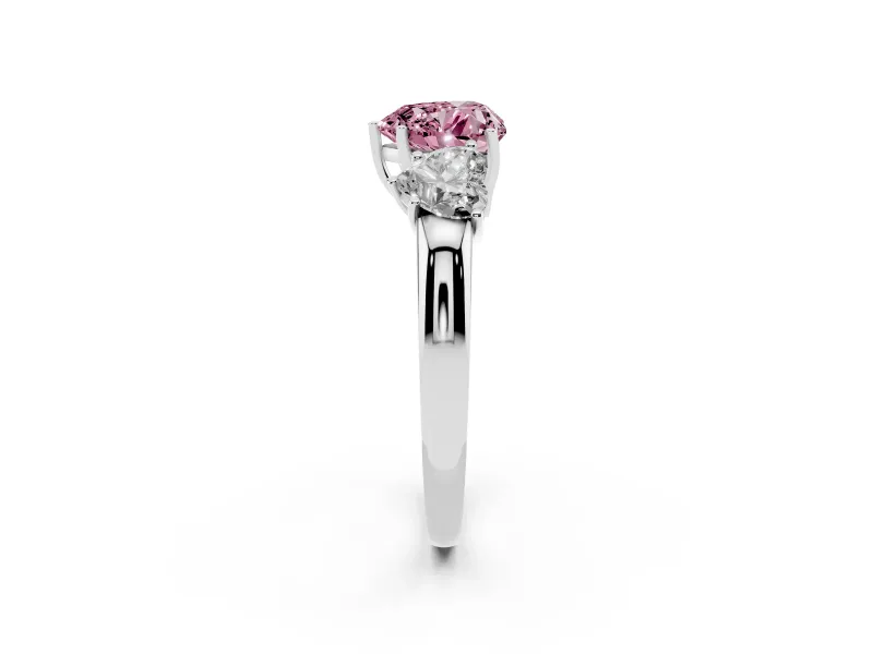 Fancy Pink Heart Cut Diamond Three-Stone Ring Set in Platinum with Bold Center and Classic Band