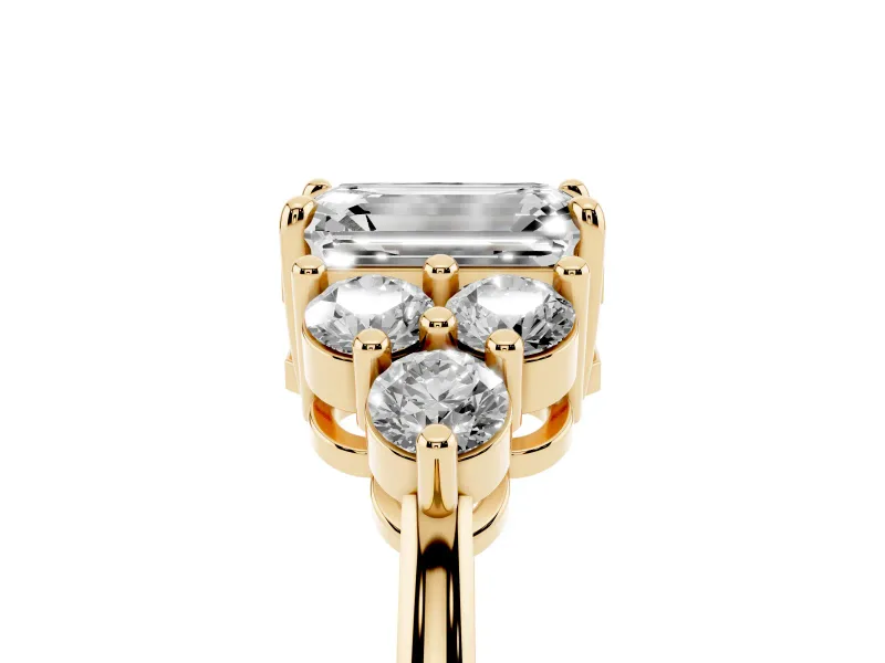 Emerald Cut Diamond Solitaire Ring Set in Yellow gold with Cluster Accents on Each Side