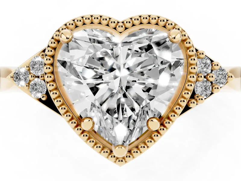 Heart Cut Diamond Milgrain Solitaire Ring Set in Yellow gold with Tapered Pavé Band and Prong Setting