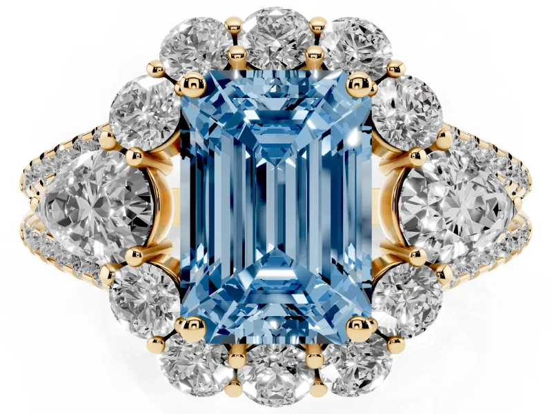 Fancy Blue Emerald Cut Diamond Halo Split Shank Engagement Ring Set in Yellow gold with Prong-Held Center Stone