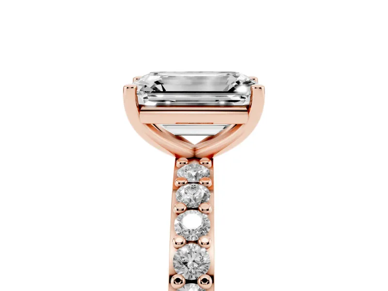 Emerald Cut Diamond Solitaire Set in Rose gold with Round Pavé Band and Prong Setting