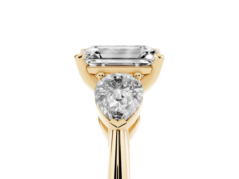 Emerald Cut Three-Stone Engagement Ring Setting | Pear Side Stones | Yellow Gold