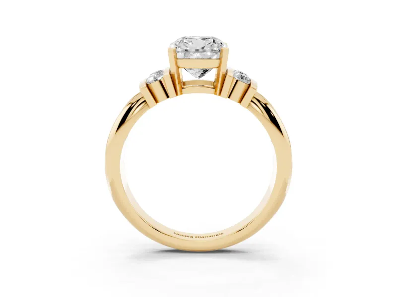 Three-Stone Cushion Cut Diamond Channel Set Ring Set in Yellow gold with Bar Prongs