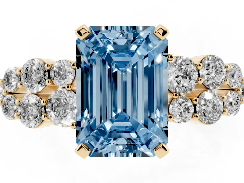 Fancy Blue Emerald Cut Diamond Cluster Engagement Ring Set in Yellow gold with Pavé Band and Prong Setting