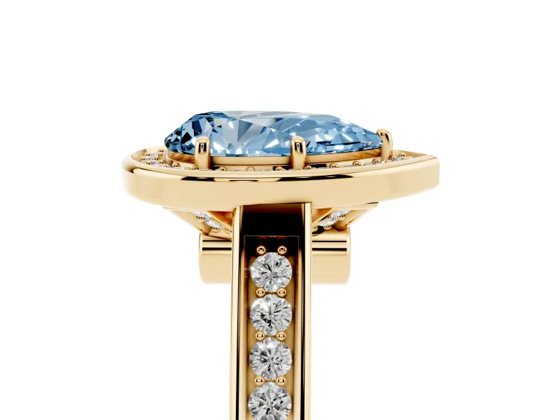 Fancy Blue Pear Cut Diamond Halo Solitaire Ring Set in Yellow gold with Pavé Band and Bezel Setting