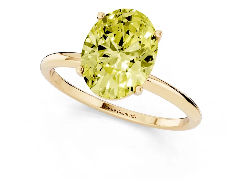 Fancy Yellow Oval Cut Diamond Solitaire Engagement Ring Set in Yellow gold with Thin Band and Prong Setting