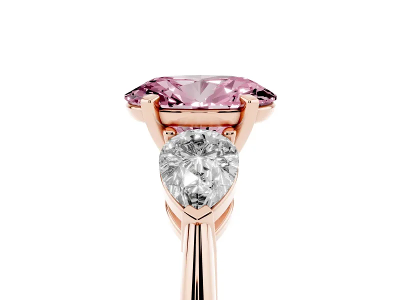 Fancy Pink Three-Stone Oval Cut Diamond Ring Set in Rose gold with Pear Side Stones and Prong Setting