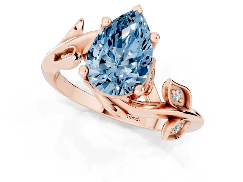 Fancy Blue Pear Cut Diamond Solitaire Twist Engagement Ring Set in Rose gold with Pavé Leaf Accents