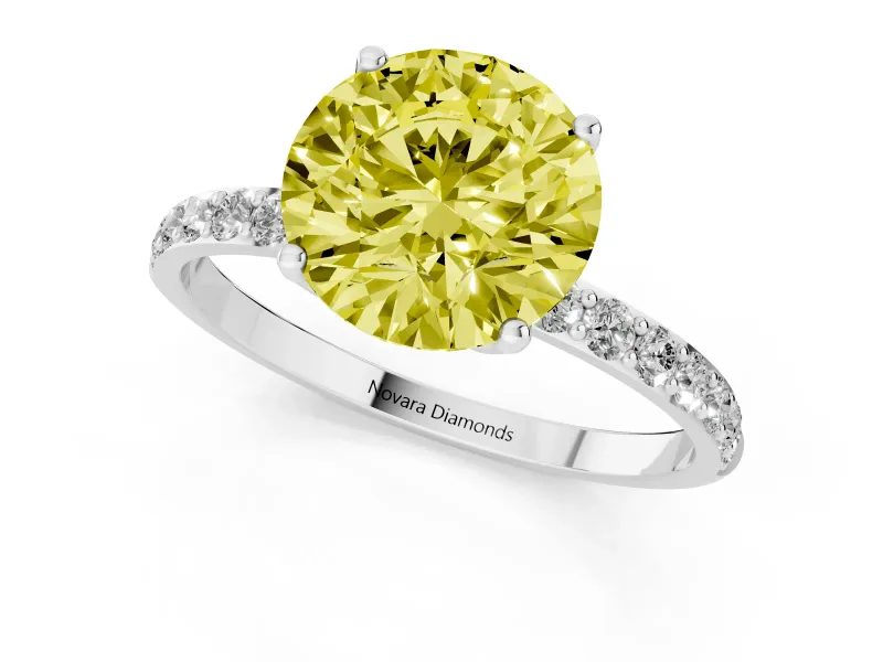 Fancy Yellow Round Cut Diamond Solitaire Engagement Ring Set in Silver with Round Pavé Band and Prong Setting