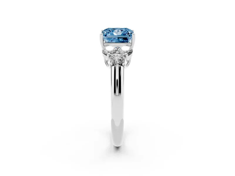 Fancy Blue Princess Cut Diamond Cluster Ring Set in Platinum with Round Accent Stones and Prong Setting on a Plain Band