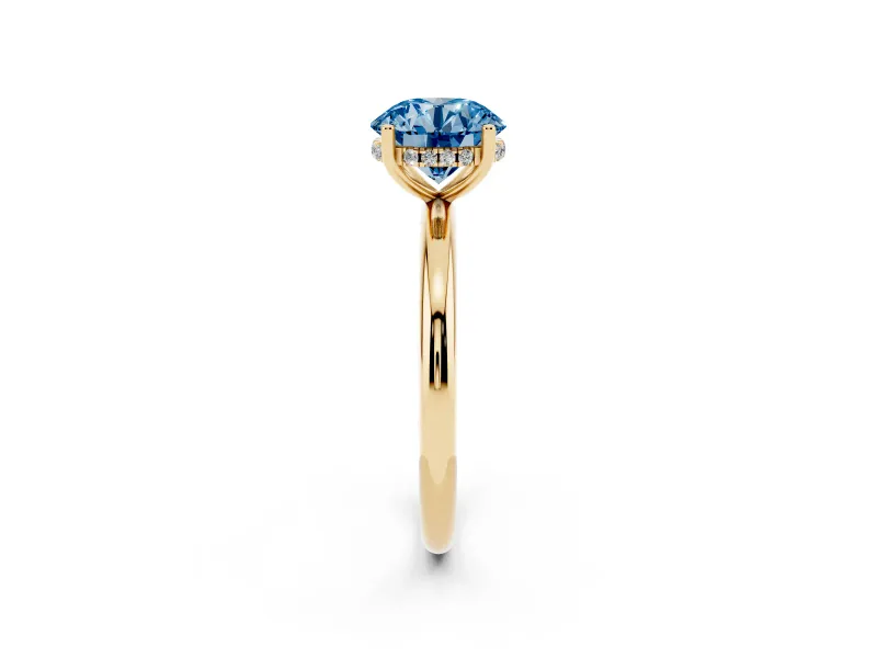 Fancy Blue Round Cut Diamond Solitaire Engagement Ring Set in Yellow gold with Prong Setting and Polished Band