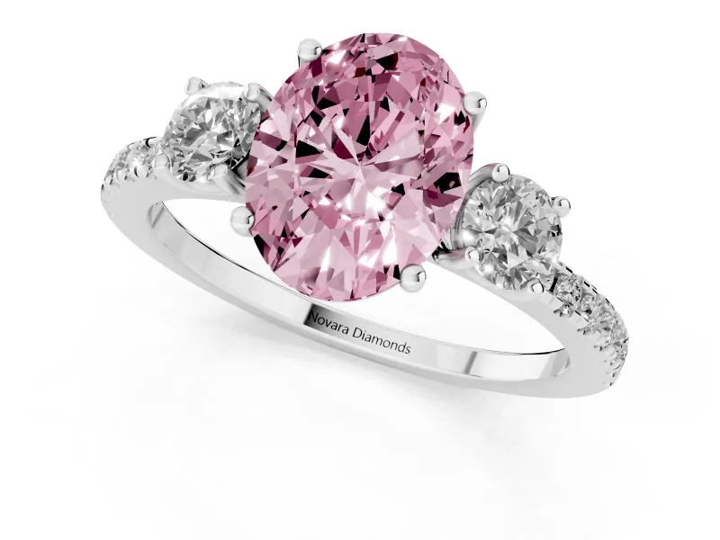 Fancy Pink Oval Cut Diamond Three-Stone Ring Set in Platinum with Pavé Band and Graduated Sides