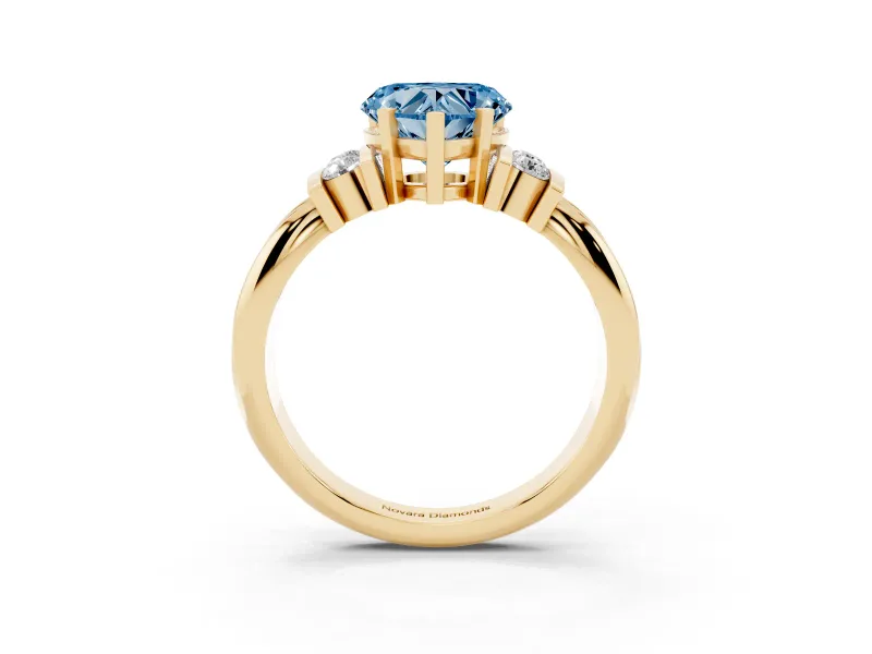 Fancy Blue Three-Stone Heart Cut Diamond Channel Set Ring Set in Yellow gold with Bar Prongs