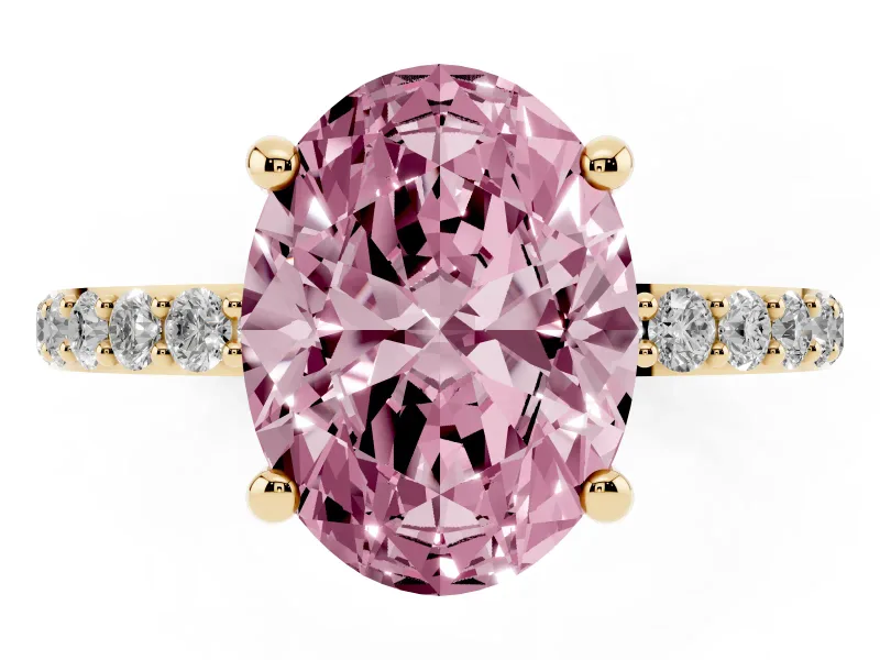 Fancy Pink Oval Cut Diamond Solitaire Ring Set in Yellow gold with Round Pavé Band and Prong Setting