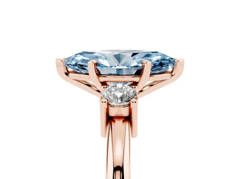 Fancy Blue Three-Stone Marquise Cut Diamond Ring Set in Rose gold with Prong Setting and Plain Band