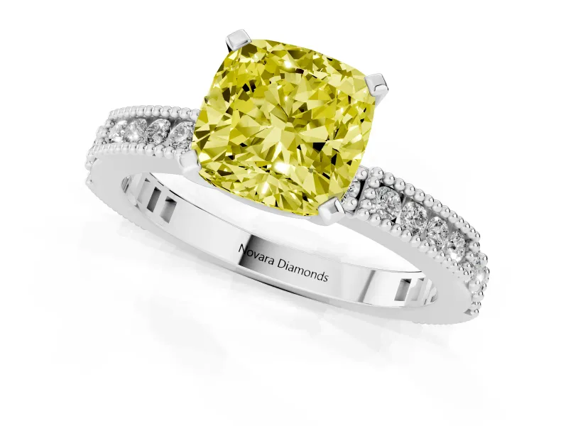 Fancy Yellow Cushion Cut Diamond Solitaire Ring Set in White gold with Slim Pavé Band and Prong Setting