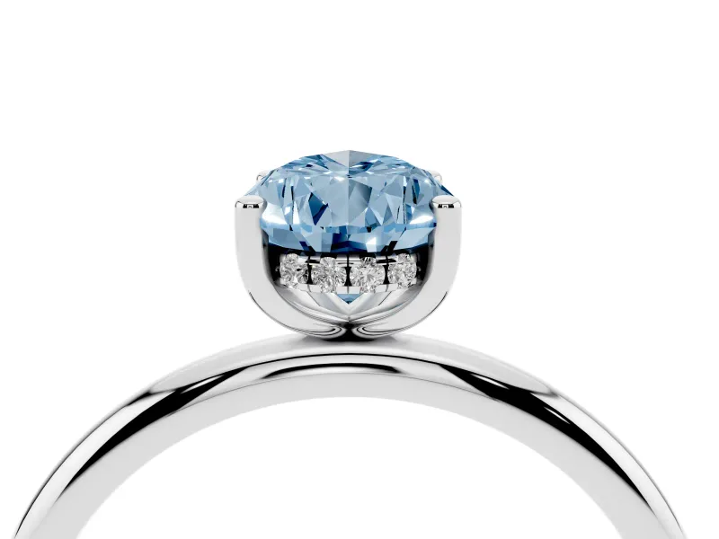 Fancy Blue Pear Cut Diamond Solitaire Engagement Ring Set in Platinum with Prong Setting and Polished Band