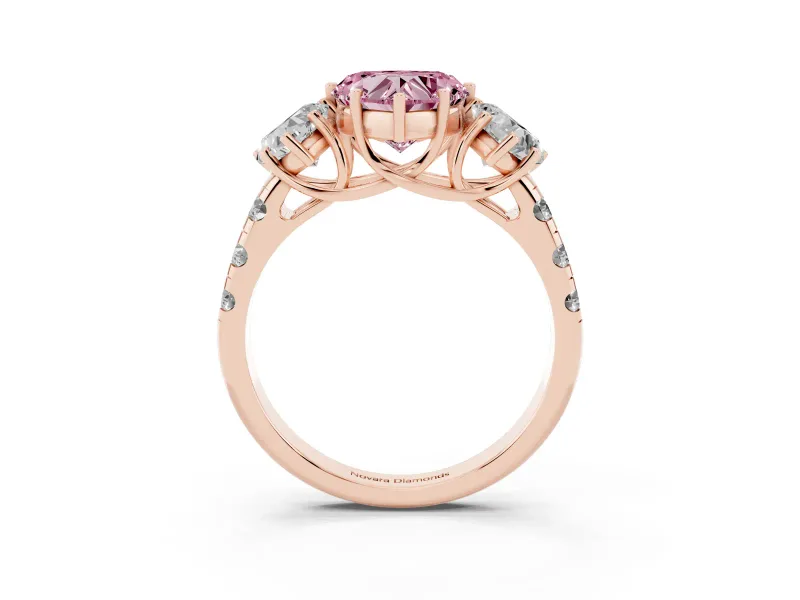Fancy Pink Heart Cut Diamond Three-Stone Ring Set in Rose gold with Pavé Band