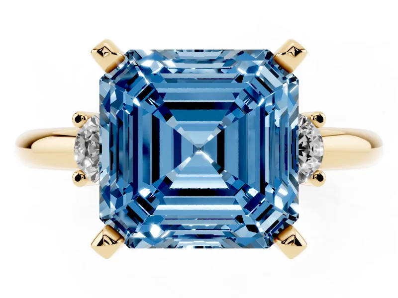 Fancy Blue Three-Stone Asscher Cut Diamond Ring Set in Yellow gold with Prong Setting and Plain Band