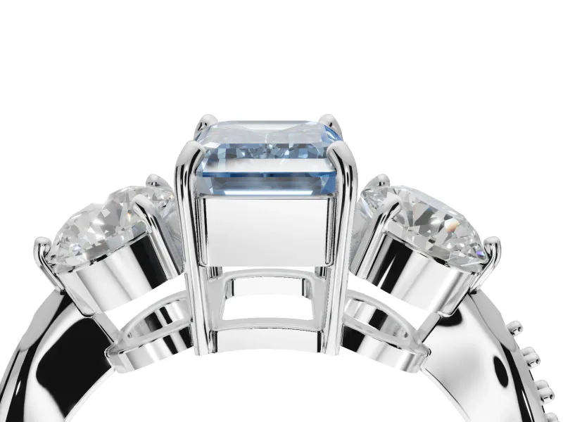 Emerald Cut Three Stone Engagement Ring Setting for a Fancy Blue Lab-Grown Diamond | Tapered Pave Band | Platinum