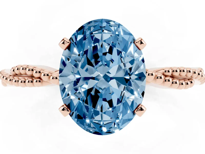 Fancy Blue Oval Cut Diamond Solitaire Ring Set in Rose gold with Twisted Band and Bead Prong Setting