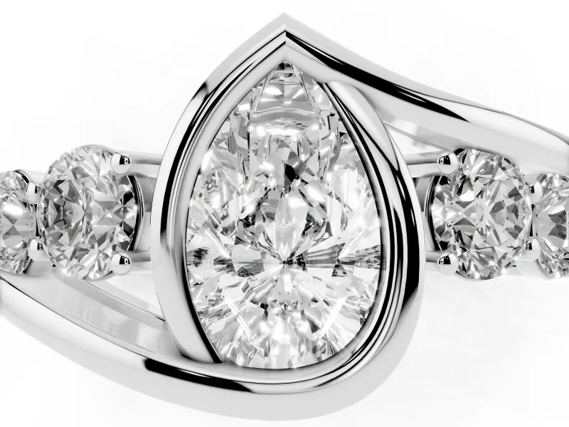 Pear Cut Diamond Bezel Bypass Ring Set in White gold with Round Accents