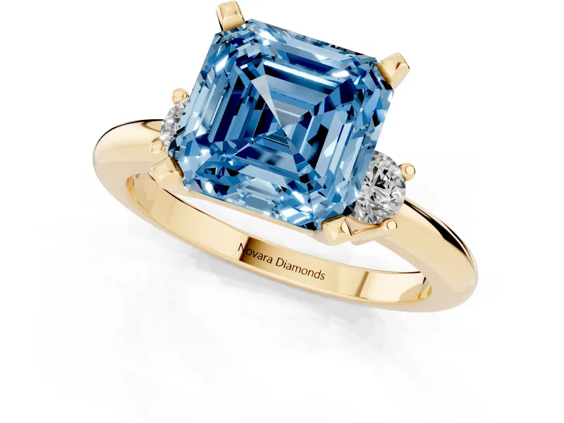 Asscher Cut Three Stone Engagement Ring Setting for a Fancy Blue Lab-Grown Diamond | Round Side Stones | Yellow Gold