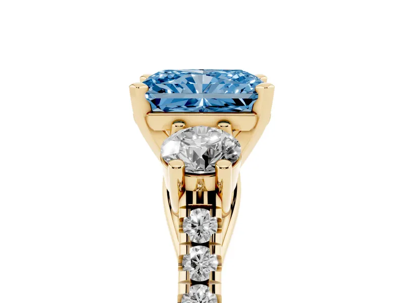 Fancy Blue Three-Stone Radiant Cut Diamond Pavé Band Ring Set in Yellow gold with Prong-Set Trio