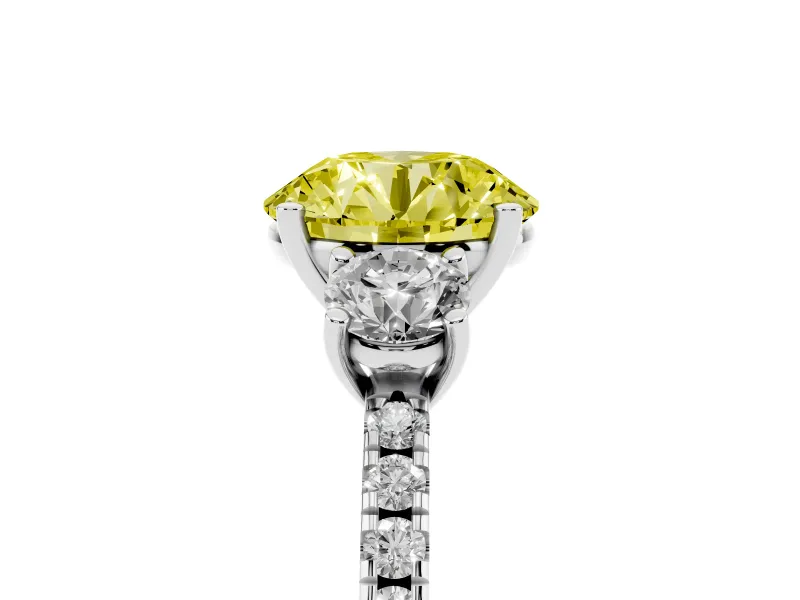Fancy Yellow Round Cut Diamond Three-Stone Ring Set in Platinum with Pavé Band and Graduated Sides
