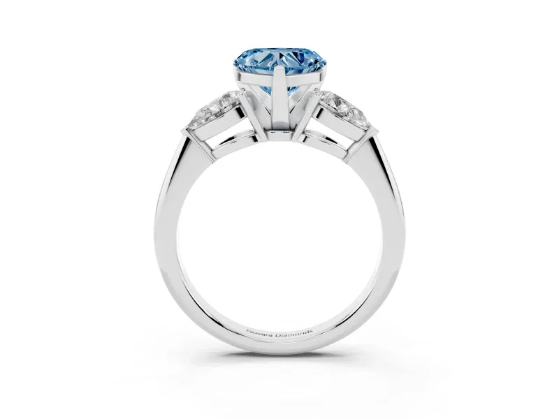Fancy Blue Three-Stone Heart Cut Diamond Ring Set in Platinum with Pear Side Stones and Prong Setting