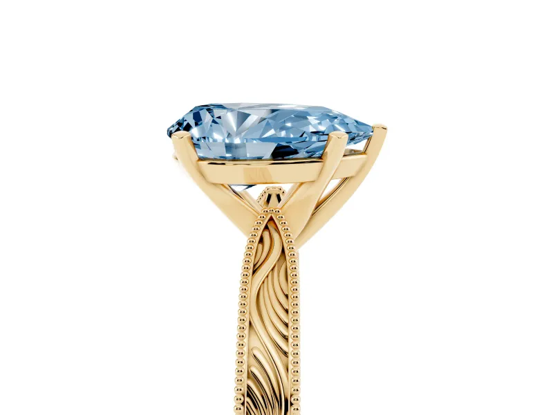 Fancy Blue Pear Cut Diamond Solitaire Milgrain Engraved Band Set in Yellow gold with Prong Setting