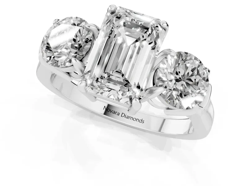 Emerald Cut Diamond Three-Stone Ring Set in Silver with Round Accent Stones and Plain Band