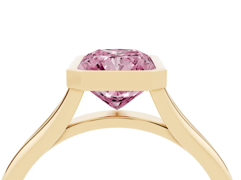 Fancy Pink Bezel Set Radiant Cut Diamond Solitaire Ring Set in Yellow gold with Tapered Band