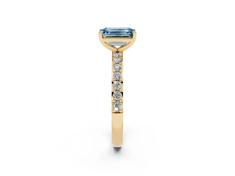 Fancy Blue Emerald Cut Diamond Solitaire Set in Yellow gold with Round Pavé Band and Prong Setting